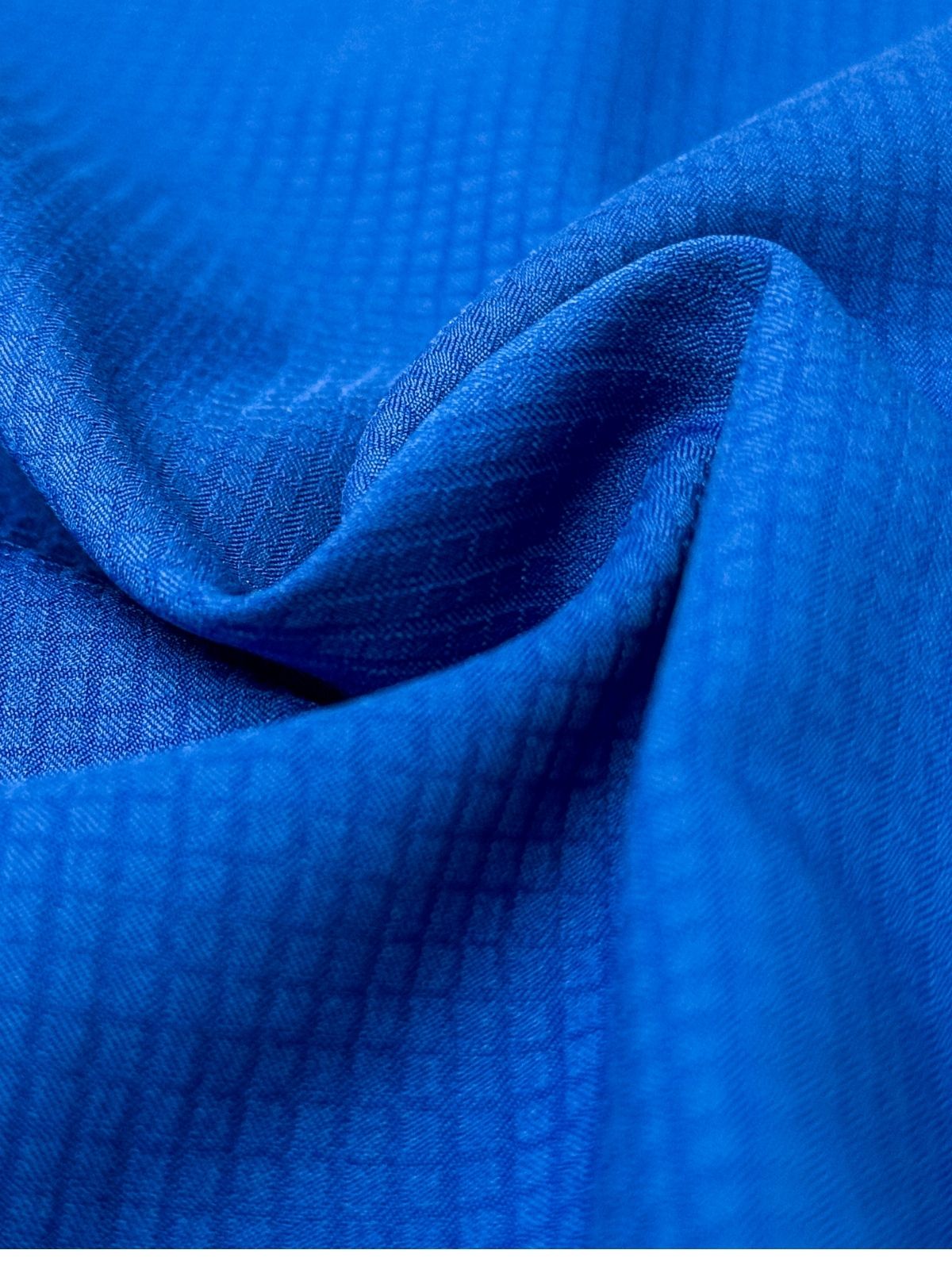 Enfoque de tela azul de camisa fishing